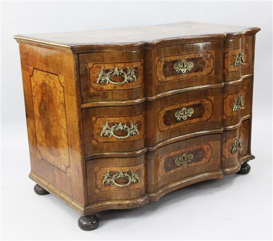 An 18th century South German crossbanded walnut serpentine commode, W.4ft 1in. D.2ft 5in. H.3ft